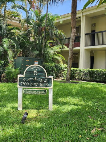 Front view of a two-story building with a sign for 'Building 6' at the entrance.