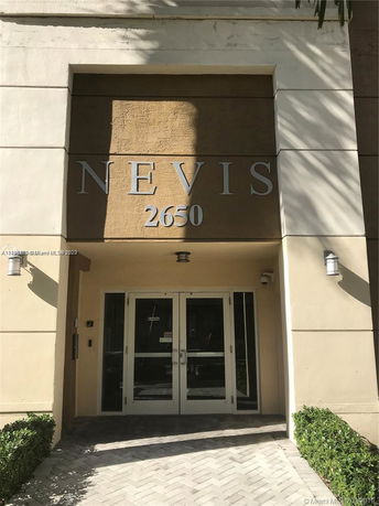 Front view of a building entrance with the name 'Nevis' and number '2650'.