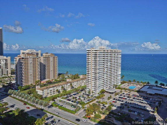 View of high-rise buildings near the ocean shoreline.