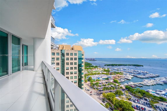 Panoramic view from a high-rise building showing a wide vista of a marina and surrounding areas.