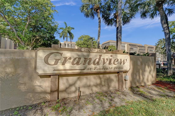 Front view of a multi-story building with a sign reading 'Grandview at Emerald Hills'.