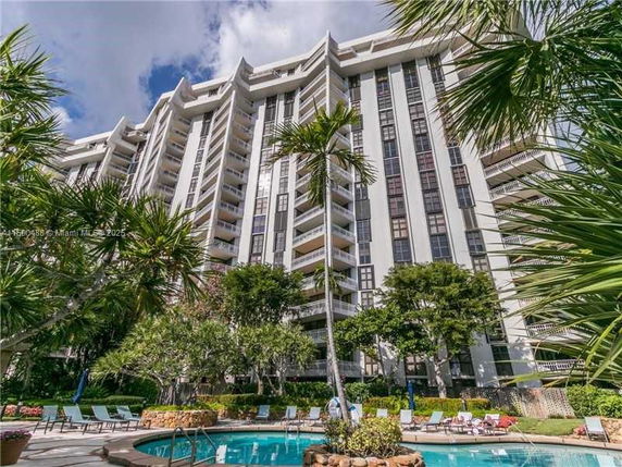 Front view of a high-rise building with multiple balconies.