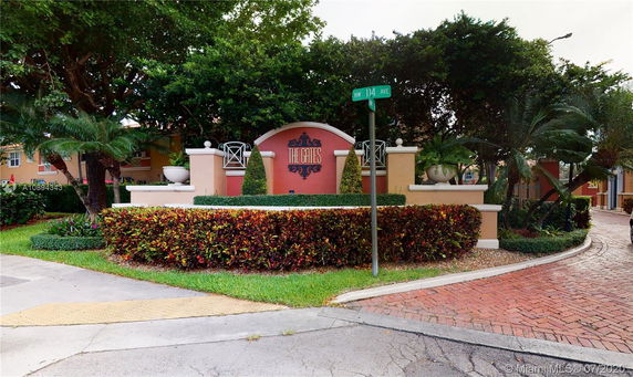 Front view of the entrance signage for a residential community labeled 'The Gates'.