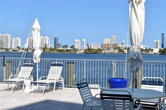 Panoramic view of waterfront with cityscape in the background.