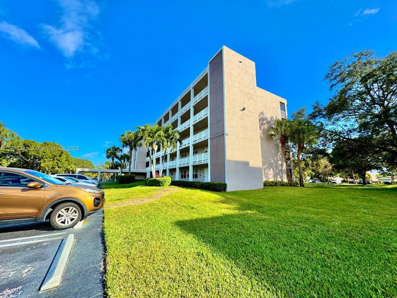 Front view of a multi-story building with balconies.
