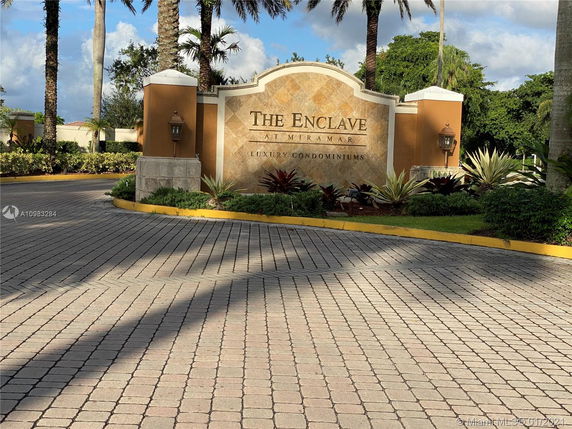 Entrance sign for The Enclave at Miramar Luxury Condominiums.