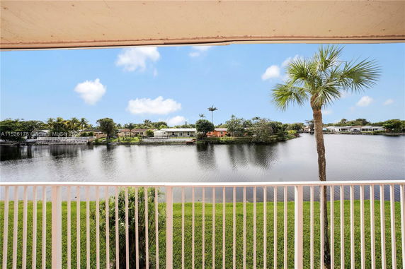 Panoramic view of a waterbody with houses on the opposite shore.