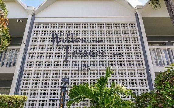 Front view of a building featuring a decorative facade with geometric patterns.