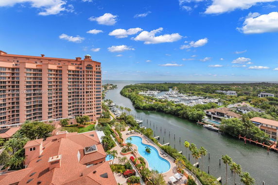 Panoramic view of a high-rise building and surrounding waterfront area.