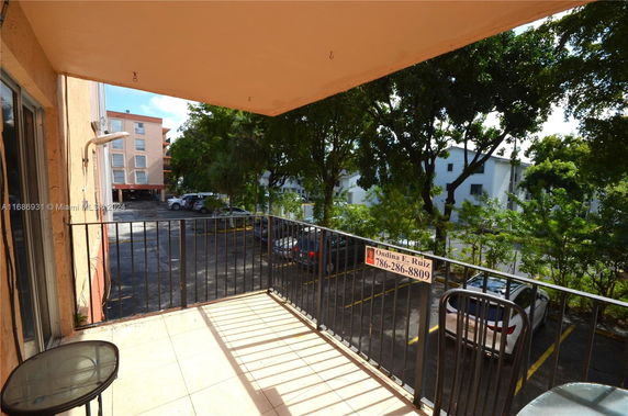 View of outdoor parking area from a balcony.