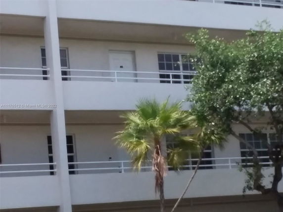 View of a multi-story building with balconies.