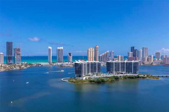 Wide-angle view showcasing multiple high-rise buildings along a waterfront.