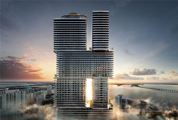 Front view of a modern skyscraper with multiple levels and unique architecture.