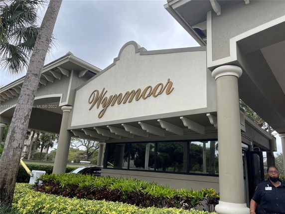 Front view of a building with the name 'Wynmoor' displayed prominently.
