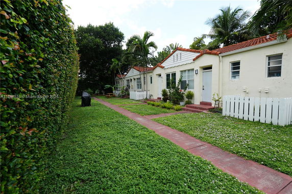 Front view of multiple single-story houses with a shared walkway.