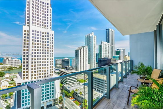 Panoramic view of a cityscape from a balcony.