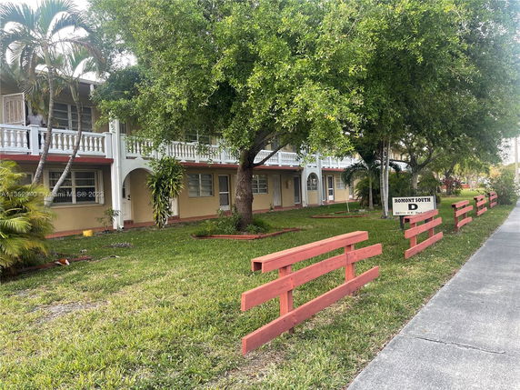 Front view of a two-story residential building with balconies.