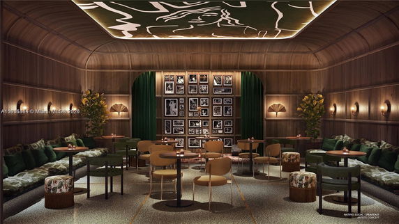 Interior view of an elegant club house with seating and wall art.