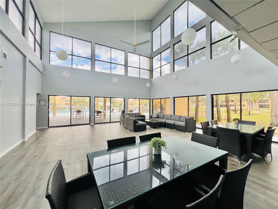 Spacious indoor communal area with large windows and modern furnishings.