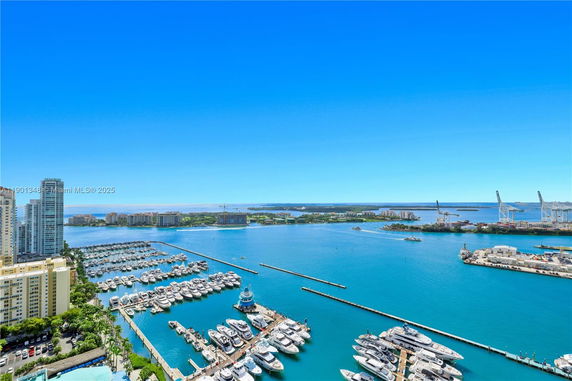 Panoramic view of a marina and surrounding water bodies from a high vantage point.