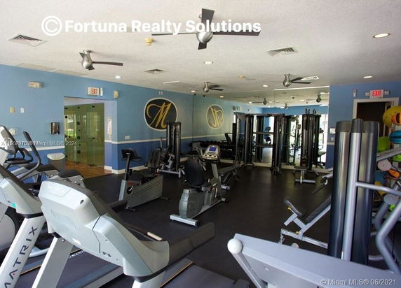 Indoor gym area with fitness equipment.