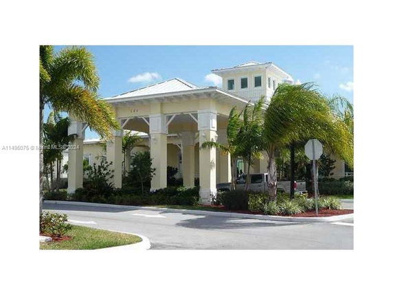 Front view of a large building with a covered entrance.