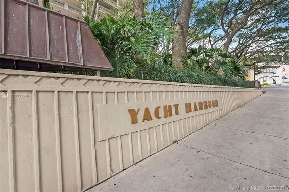 Front view of a structure with a sign reading 'Yacht Harbour'.