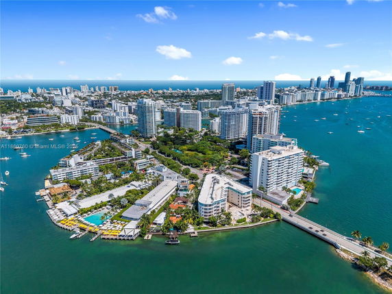 Panoramic view of a coastal city with high-rise buildings along the waterfront.