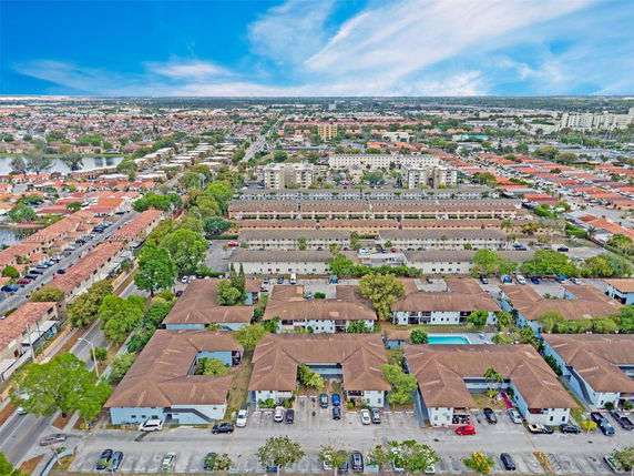 Aerial view of a residential area with multiple buildings and roads.