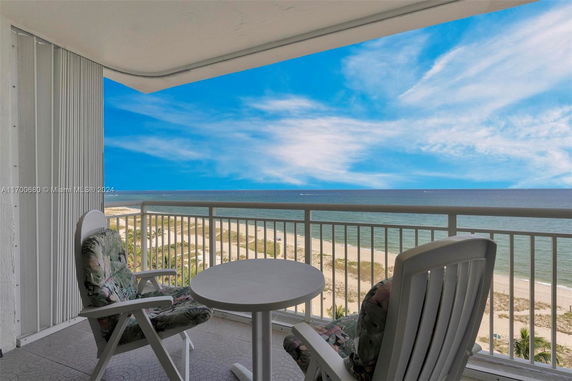 Balcony view over the beach and ocean.