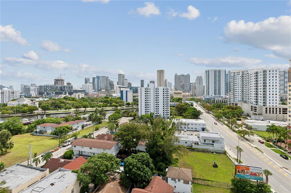 View of a cityscape with multiple high-rise buildings and residential areas.
