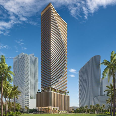 Front view of a modern high-rise building with a curved façade.