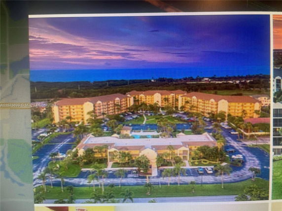 Panoramic view of a large apartment complex at sunset.