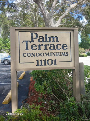 Sign for Palm Terrace Condominiums at address 11101.