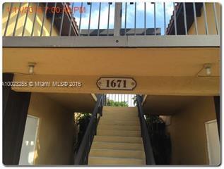 Entrance of a building with stairs leading up and visible unit number 1671.