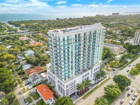 Front view of a multi-story building with balconies.