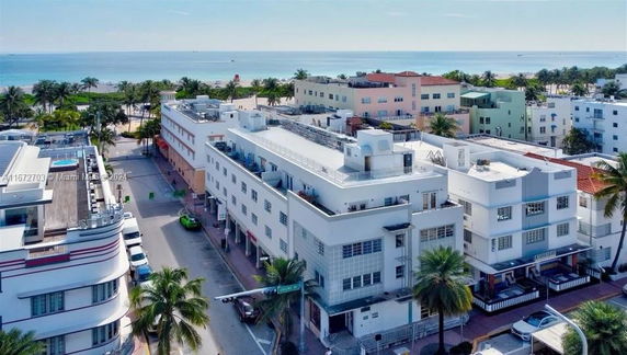 Aerial view of buildings near a beach.