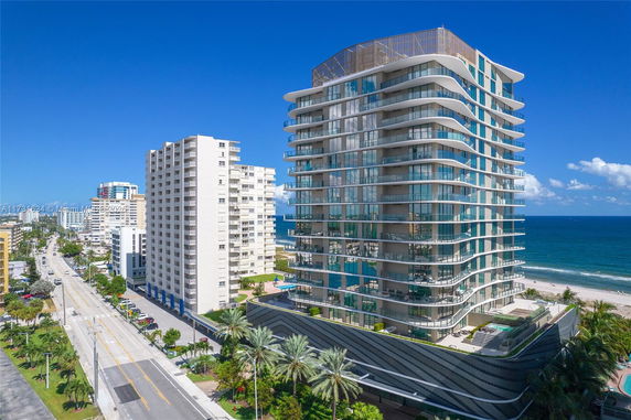 Front view of a modern high-rise building near the beachfront.