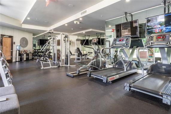 Interior view of a gym with various exercise equipment.