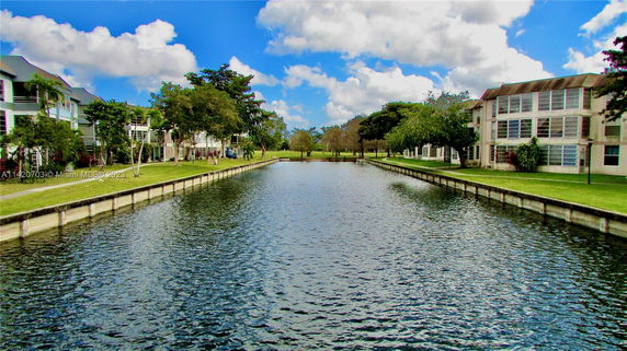 View of residential buildings facing a waterway.