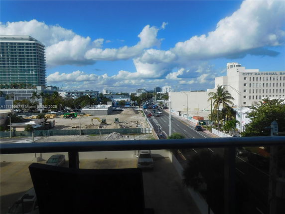 Panoramic view of a cityscape with buildings and a construction site.