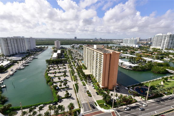 Panoramic view of a coastal area with residential buildings and waterways.