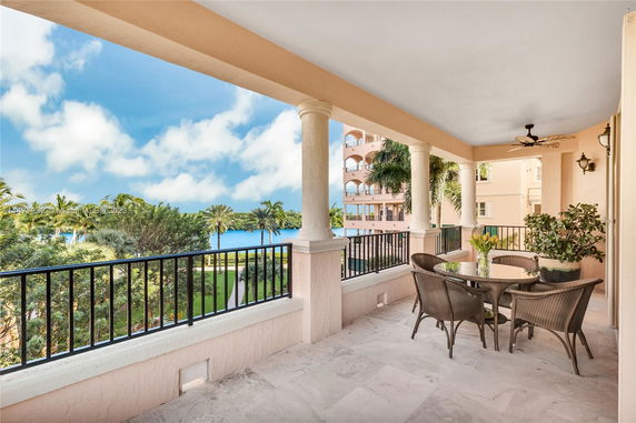 Balcony view with seating and scenic surroundings.