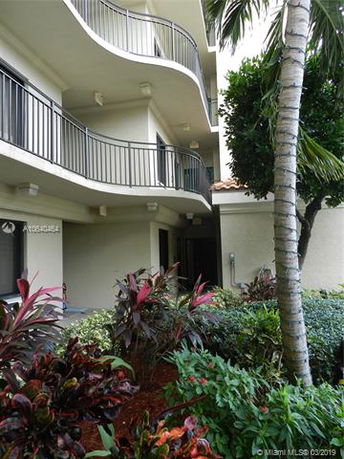 Exterior view of a multi-story building with balconies.
