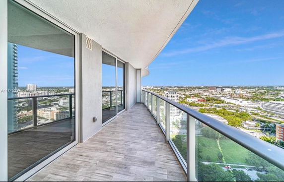 Balcony with a panoramic view of the city landscape.