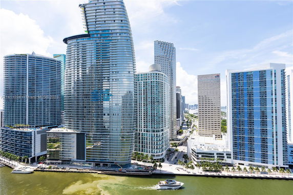 View of modern high-rise buildings along a waterfront area.