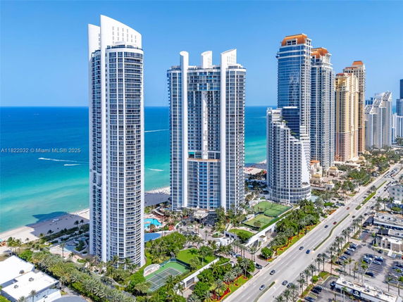 Front view of tall beachfront skyscrapers with modern design.