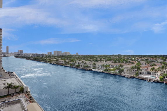 View of waterfront residential area with houses lining a canal.