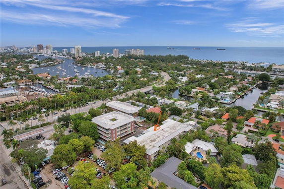 Panoramic view of a coastal area with buildings, roads, and waterways.