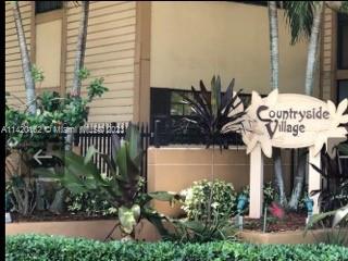 Front view of a building with a sign reading Countryside Village.